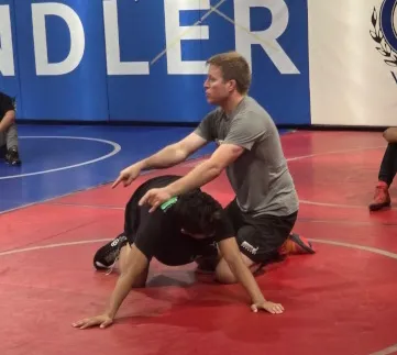 Coach Owen Teaching wrestling techniques near Mesa, AZ