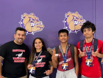 Coach Reyes and wrestlers at Preseason State at Queen Creek High School in Queen Creek, AZ
