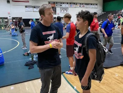 Coach Owen giving wrestling advice to one of Southwest's youth wrestlers!