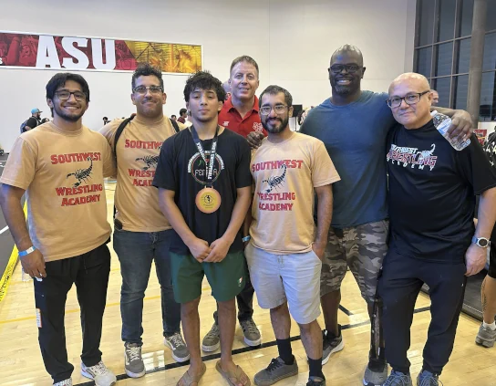 Coach Owen and coaches with wrestlers at unstoppable wrestling tournament Tempe, AZ